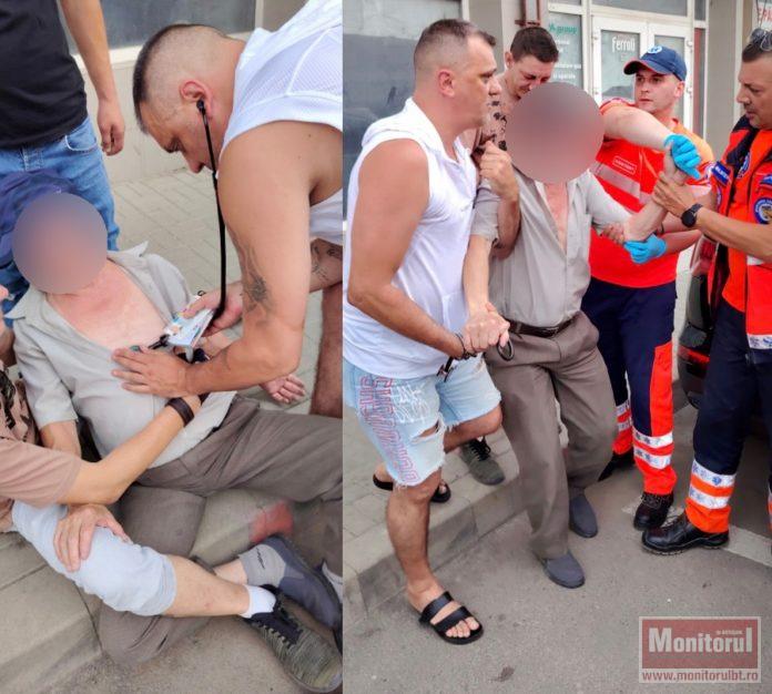 Bărbat prăbușit în stradă, ajutat de un asistent aflat în timpul liber